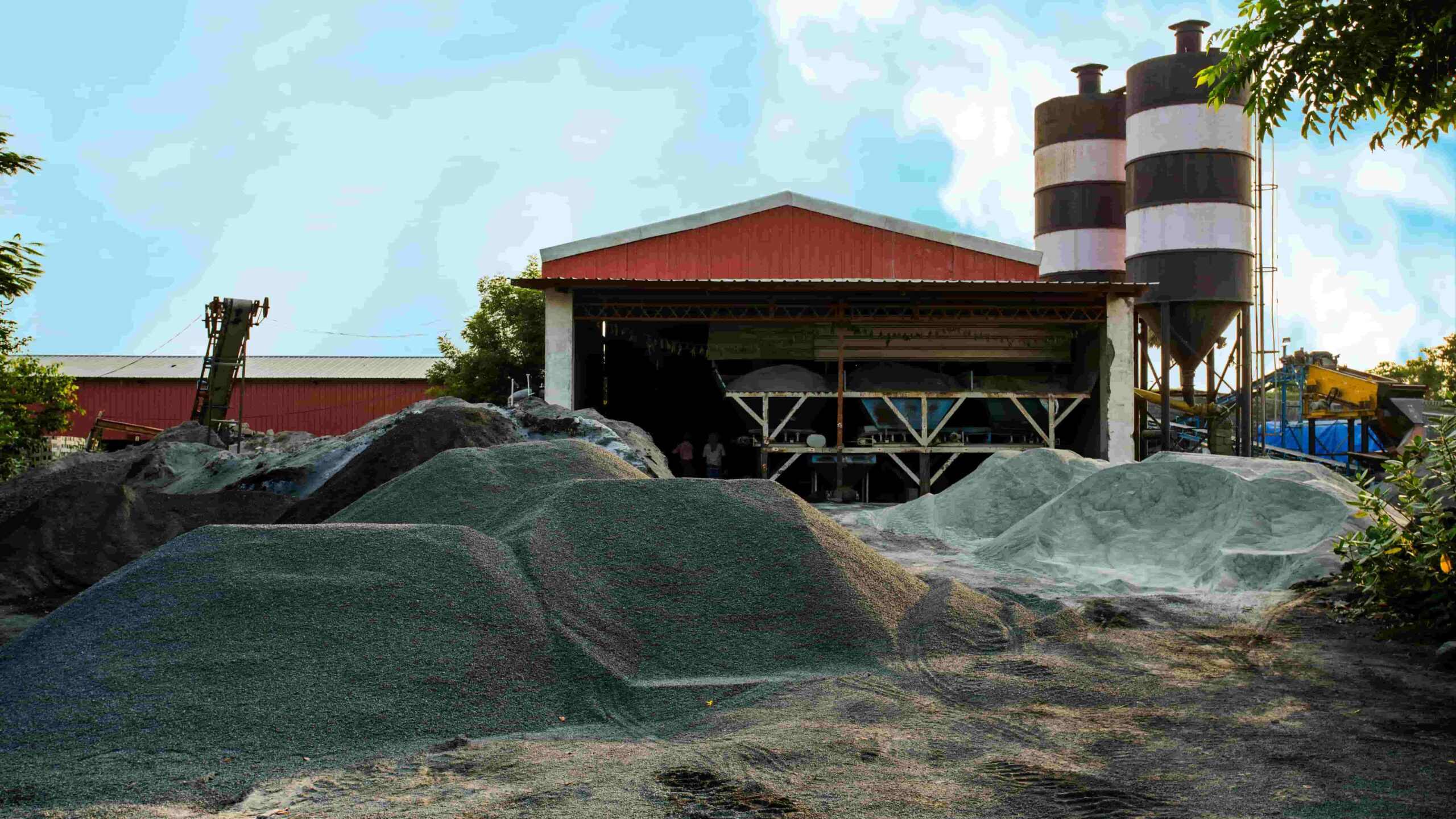 Fly ash piles in front of a mining facility